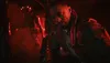 A close-up of a man in a dark, red-lit environment, possibly from a video game. Produktbild-Vorschau