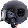 A black matte Caberg Ghost X Jethelm motorcycle helmet is shown from a side angle against a white background. Voir les images du produit