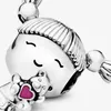 Close-up of a silver charm depicting a little girl holding a teddy bear with a pink heart. Podgląd zdjęcia produktu