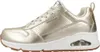 A side view of a gold SKECHERS UNO-METALLIXS sneaker. Voir les images du produit