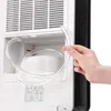 A hand is holding a clear plastic tube connected to a white appliance, possibly a dehumidifier. Produktbild-Vorschau
