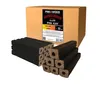A cardboard box of wood briquettes with several briquettes stacked in front of it. Produktbild-Vorschau