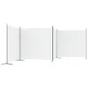 Three white fabric screens are set up in a row, supported by dark metal poles and bases, against a white background. Náhled obrázku produktu