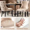 Two beige dining chairs are shown in a dining room setting, with a table in the background. Insets below highlight the fabric and foam of the chairs. Produktbild-Vorschau