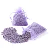 Two small lavender sachets, one spilling its contents onto a white surface. Produktbild-Vorschau