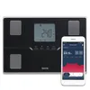 A smart scale and a smartphone displaying health data. Produktbild-Vorschau