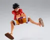 A figurine of Monkey D. Luffy from One Piece in a dynamic pose against a plain background. Podgląd zdjęcia produktu