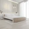 A modern bedroom with a bed, bedside table, and decorative elements. Náhled obrázku produktu