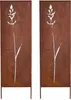 Two identical metal garden screens with a cut-out design of a grass stalk, standing on white legs. Podgląd zdjęcia produktu