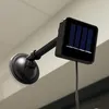 A solar-powered LED light fixture with a suction cup mount is shown attached to a surface, likely a window or wall. Náhled obrázku produktu