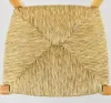 A close-up view of the woven straw seat of a chair, showing the texture and pattern. Produktbild-Vorschau