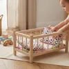 Ein Puppenbett aus Holz in einer natürlichen Farbe mit Produktbild-Vorschau 6