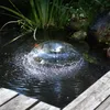 A fountain pump in a pond with wooden planks in the foreground. Produktbild-Vorschau