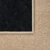 A close-up view of a carpet, showing the texture and edge binding. Produktbild-Vorschau