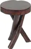 A dark brown, solid wood side table with a round, irregular top and three crossed legs. Náhled obrázku produktu