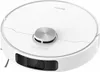 A white robot vacuum cleaner with a silver top. Voir les images du produit