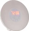 A digital alarm clock with a circular display. Voir les images du produit