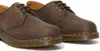 A close-up, studio shot of a pair of brown leather Dr. Martens shoes. Anteprima dell’immagine prodotto