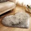 A heart-shaped rug is placed on a wooden floor next to a sofa. A basket of books is visible in the background.