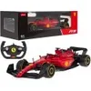 A red remote-controlled Ferrari Formula 1 car and its packaging, along with a steering wheel controller. Podgląd zdjęcia produktu
