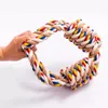A hand holding a colorful rope toy. Produktbild-Vorschau