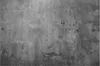 A close-up, textured view of a metallic magnetic board with a concrete or cement-like appearance. Anteprima dell’immagine prodotto