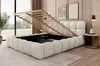 A bedroom scene with a bed that has its storage compartment open, revealing the slatted base. The bed is upholstered in bouclé fabric and is placed on a rug. Produktbild-Vorschau
