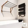 A bathroom with a bathtub, a wall-mounted drying rack, and a heated towel rail. Anteprima dell’immagine prodotto