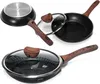 A collection of cookware, including frying pans and lids, arranged on a white background. Anteprima dell’immagine prodotto