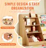 A wooden bookshelf for children, with toys and books displayed. Anteprima dell’immagine prodotto