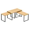 Three nesting tables with wooden tops and black metal frames, arranged in a stepped configuration. Produktbild-Vorschau