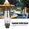 A fountain nozzle is shown in the foreground with a garden fountain in the background. Podgląd zdjęcia produktu