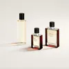 Three bottles of perfume are arranged on a white surface. Anteprima dell’immagine prodotto