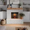 A cozy living room scene featuring a fireplace with a fire burning, a wooden mantelpiece, and decorative items. Produktbild-Vorschau