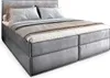 A studio shot of a bed with pillows and blankets. Produktbild-Vorschau