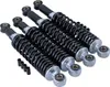 Four black shock absorbers with silver ends are arranged diagonally on a white background. Náhled obrázku produktu