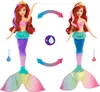 Two Ariel mermaid dolls are shown side-by-side, demonstrating a color-changing feature with water. Anteprima dell’immagine prodotto