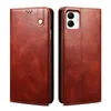 A brown leather phone case is shown from the front and back. Produktbild-Vorschau