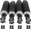 Four black shock absorbers with silver accents are displayed against a white background. Náhled obrázku produktu