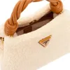 A close-up view of a beige fuzzy handbag with a braided brown handle and a gold Guess logo. Produktbild-Vorschau