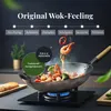 A wok filled with food being cooked on a gas stove, with text overlays describing features. Produktbild-Vorschau