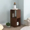 A corner of a room with a wooden shelf unit, a plant, and a teddy bear in a basket. Anteprima dell’immagine prodotto