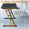 A black gaming desk with a Z-shaped frame, highlighted with an orange outline. Text describes its stability and weight capacity. Produktbild-Vorschau