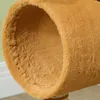 A close-up view of the interior and exterior of a fuzzy brown tunnel, likely part of a cat tree. Produktbild-Vorschau