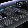 A gaming mousepad with keyboard shortcuts and a mouse and headphones on top. Voir les images du produit