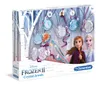 The image shows the packaging of a Disney Frozen 2 crystal jewel making kit. The box features illustrations of characters from the movie, Anna and Elsa, along with the crystal jewels and tools included in the set. The background depicts a winter forest sce Produktbild-Vorschau