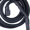A black vacuum cleaner hose and handle are coiled on a white background. Anteprima dell’immagine prodotto