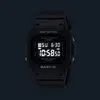 A black digital watch with a glowing screen against a dark background. Voir les images du produit
