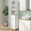 A modern bathroom with a tall white cabinet with wood accents, a sink, and a large potted plant. Voir les images du produit