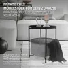 A modern living room setting with a sofa and a side table. Náhled obrázku produktu